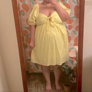 Adorable yellow summer dress with chest cutout and puffy sleeves